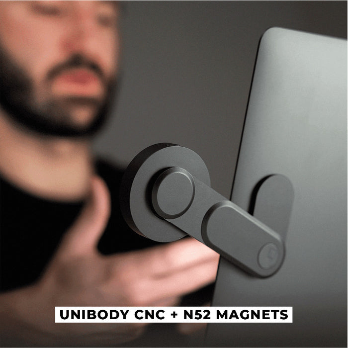 EDGE® Full Kit - Productivity magnetic kit - EDGE® Full Kit - Productivity magnetic kit - Carrara White - Matte black magnetic arm mount attached to the back of a silver laptop with circular magnet pads. - Rolling Square EDGE® Full Kit - Productivity magnetic kit - Carrara White - Matte black magnetic arm mount attached to the back of a silver laptop with circular magnet pads. - Rolling Square