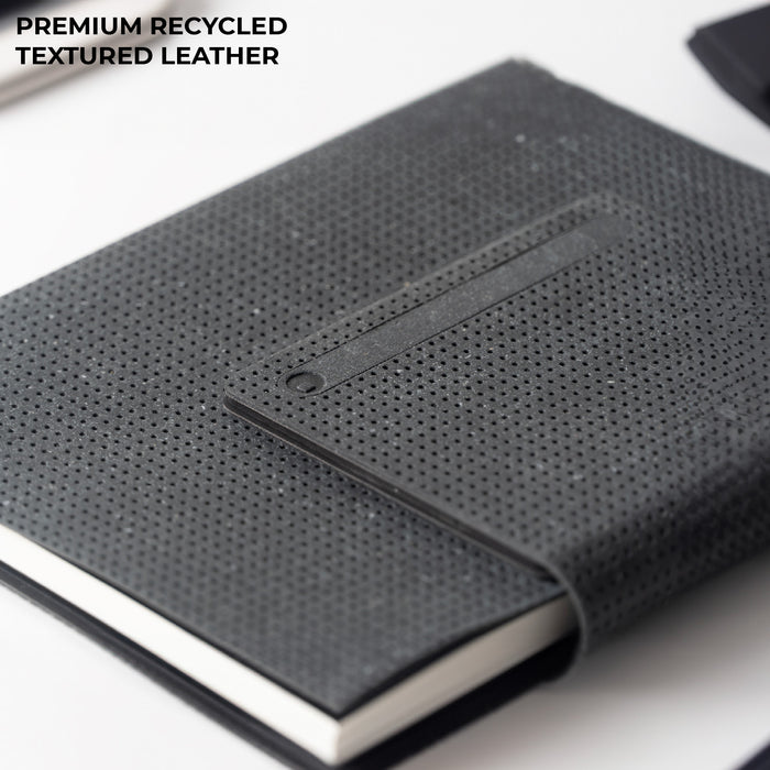 AirCard™ Notebook - A5 notebook made for AirCard - AirCard™ Notebook - A5 notebook made for AirCard - Grainy Black - A5 notebook with grainy black recycled textured leather cover and elastic closure band. - Rolling Square AirCard™ Notebook - A5 notebook made for AirCard - Grainy Black - A5 notebook with grainy black recycled textured leather cover and elastic closure band. - Rolling Square