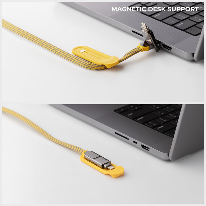 inCharge® XL 3m / 10ft - 100W, 6in1 ultra long cable - inCharge® XL 3m / 10ft - 100W, 6in1 ultra long cable - Urban Black - Yellow 3m inCharge XL 6-in-1 ultra long charging cable with magnetic desk support connected to laptop. - Rolling Square inCharge® XL 3m / 10ft - 100W, 6in1 ultra long cable - Urban Black - Yellow 3m inCharge XL 6-in-1 ultra long charging cable with magnetic desk support connected to laptop. - Rolling Square