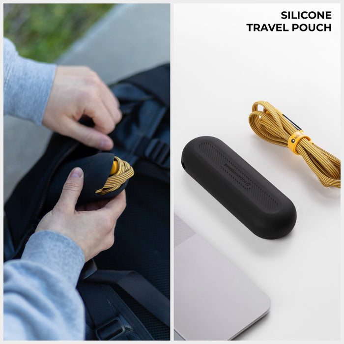 inCharge® XL 3m / 10ft - 100W, 6in1 ultra long cable - inCharge® XL 3m / 10ft - 100W, 6in1 ultra long cable - Urban Black - Black silicone travel pouch next to a coiled yellow charging cable and a laptop on white surface, hand holding pouch near. - Rolling Square inCharge® XL 3m / 10ft - 100W, 6in1 ultra long cable - Urban Black - Black silicone travel pouch next to a coiled yellow charging cable and a laptop on white surface, hand holding pouch near. - Rolling Square