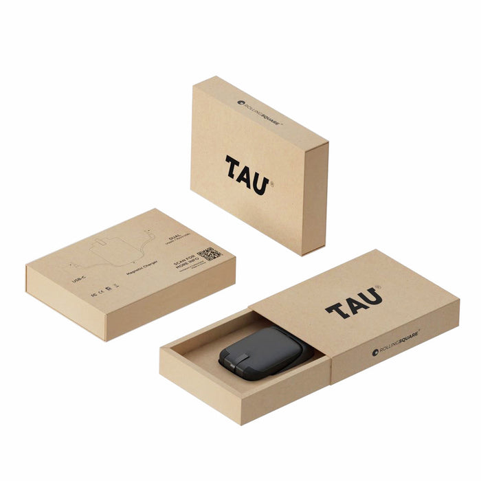 TAU® - Always-charged power bank - TAU® - Always-charged power bank - Charcoal Black - Charcoal black sleek power bank in minimalistic beige TAU branded box with sliding cover and two closed boxes nearby. - Rolling Square TAU® - Always-charged power bank - Charcoal Black - Charcoal black sleek power bank in minimalistic beige TAU branded box with sliding cover and two closed boxes nearby. - Rolling Square