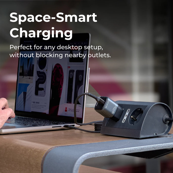 Laptop on a desk with a space-saving charging station and a Supertiny plugged in, text 'Space-Smart Charging'.