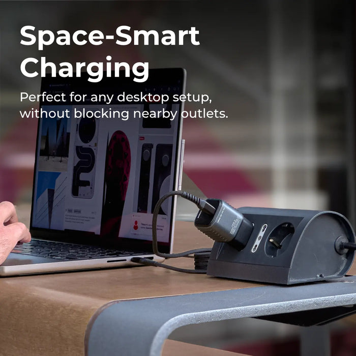 Laptop on a desk with a space-saving charging station and a Supertiny plugged in, text 'Space-Smart Charging'.