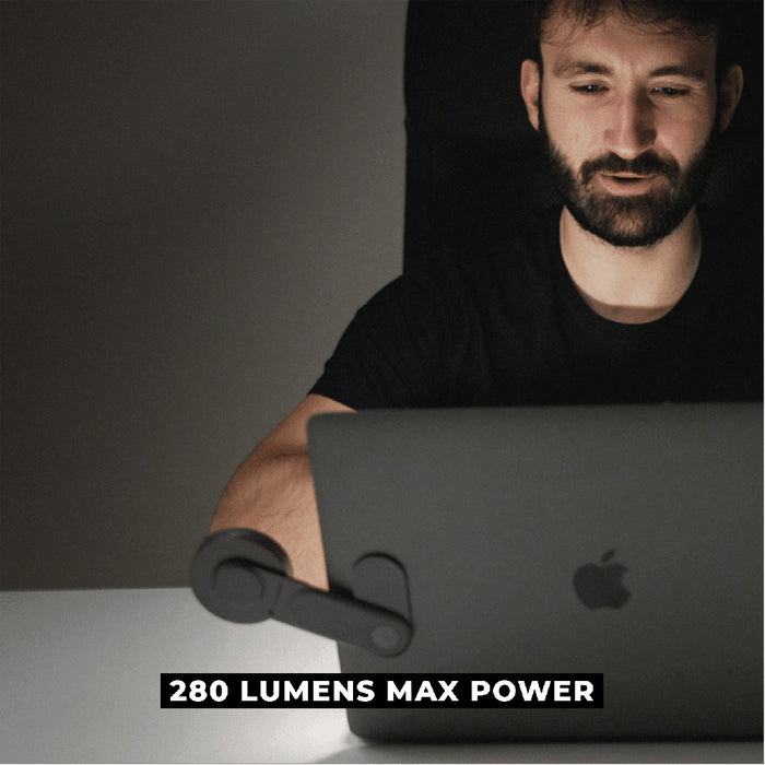 EDGE® Full Kit - Productivity magnetic kit - Carrara White - Black magnetic desk lamp with flexible arm attached to a laptop, illuminating workspace with 280 lumens max power. - Rolling Square