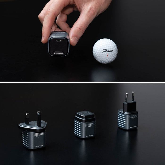 Supertiny 65W - Compact black 65W charger shown next to golf ball for size comparison and three plug variants included to display their small size - Rolling Square