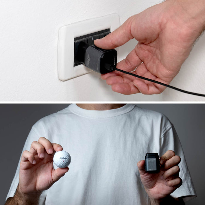 Supertiny 65W - Compact black 65W charger plugged into white wall outlet with hand holding Charger, and person in white shirt holding charger in comparison to a golf ball. - Rolling Square